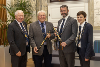 Bill Duncan and Billy Pennycook receive their Long Service batons from Provost McDade 3 September 2024